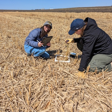 Jalissa and undergraduate researcher collect field validation data.